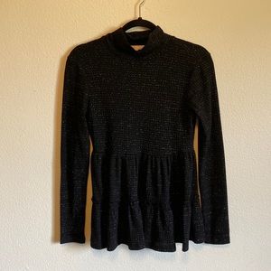 Black, sparkly long sleeve top with flared bottom